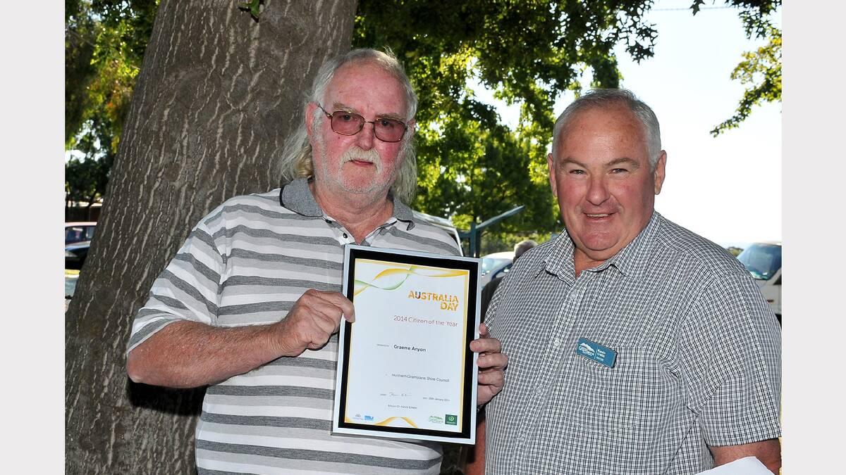 Stawell's Citizen of the Year Graeme Anyon, accepts his award from Northern Grampians Shire Mayor, Cr Kevin Erwin, at the awards ceremony at Cato Park. Picture: MARK McMILLAN.