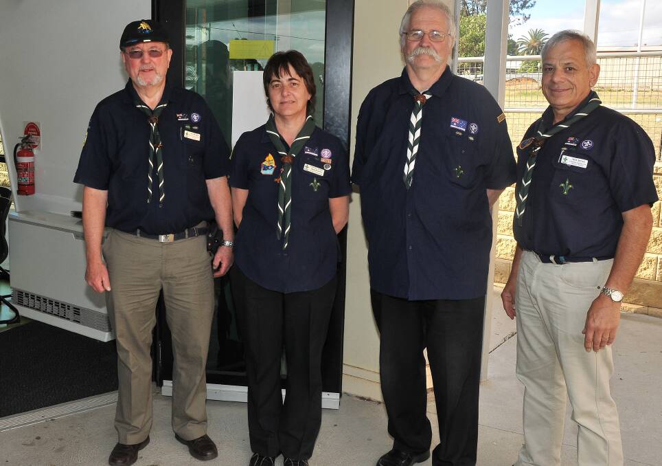 Jon Peart, Ann Pearce, Jeff Parson and Neil Hunt are pictured in Scouts attire. 