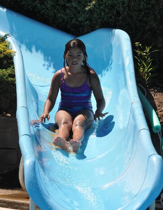 Jaala Lovett keeps cool by taking a journey down one of the water slides.