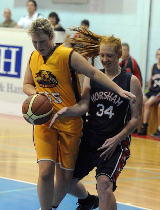 Stawell Lady Wildcat Grace Bibby has control of the ball in front of Hornet Chloe Bibby during the clash last weekend. Picture: WIMMERA MAIL-TIMES.