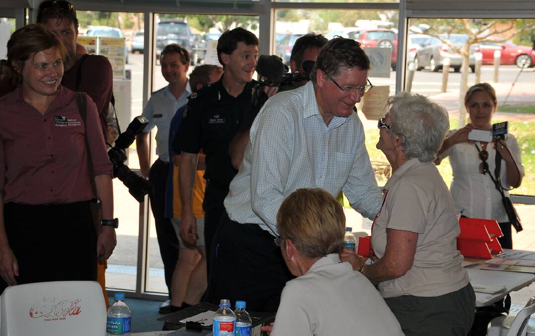 Premier Denis Napthine met with volunteers and evacuees at the Stawell relief centre. Pictures: MARK McMILLAN.