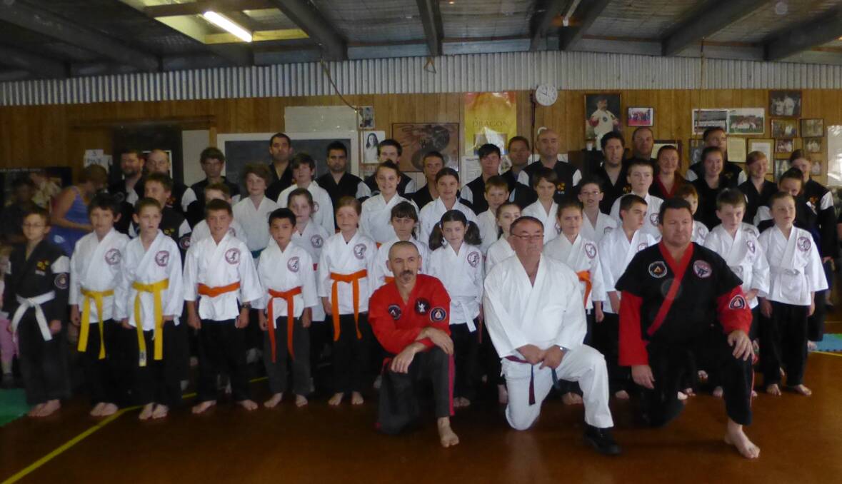 Percy Walsh (front centre) is pictured with the large contingent of Stawell and Horsham karate students who were put through their paces during a combined grading day.