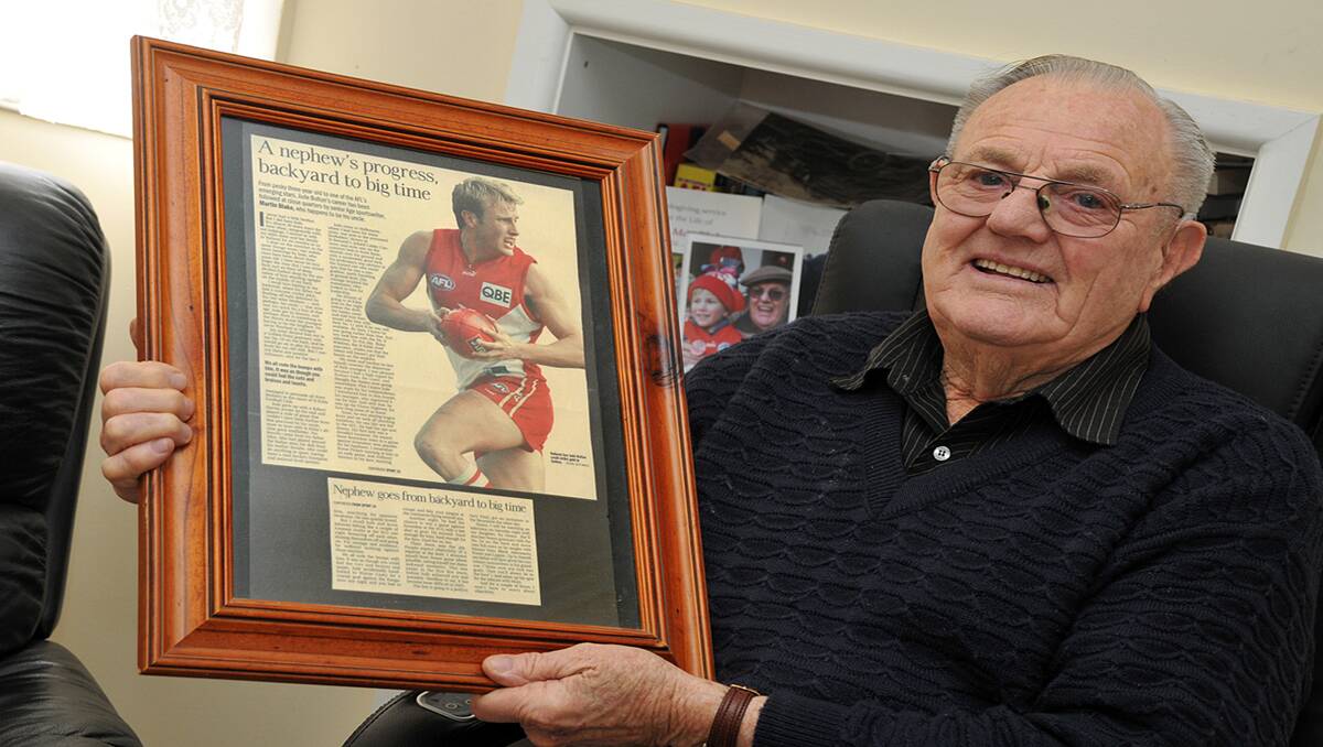 Harold Blake holds an article on his grandson Jude Bolton which was written by Martin Blake, Harold's son, a former Melbourne Age journalist. Picture: KERRI KINGSTON
