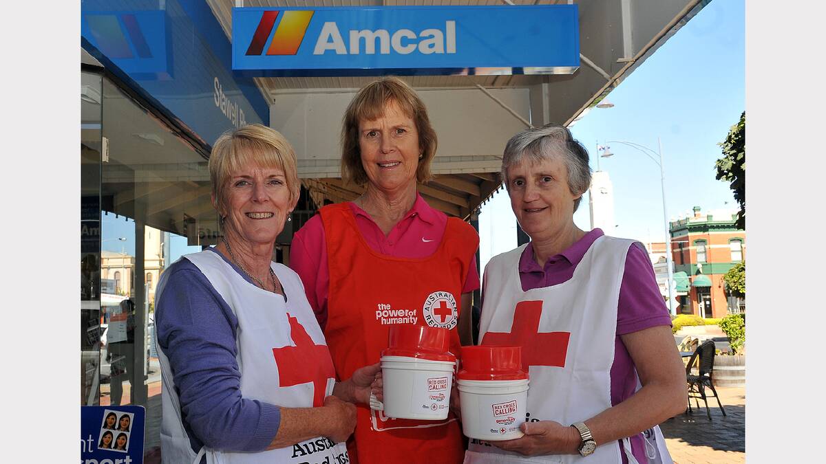 Stawell Red Garters members Kerry Hapgood, Helen Dean and Fran McKenney prepare for this week's Red Cross March Appeal.