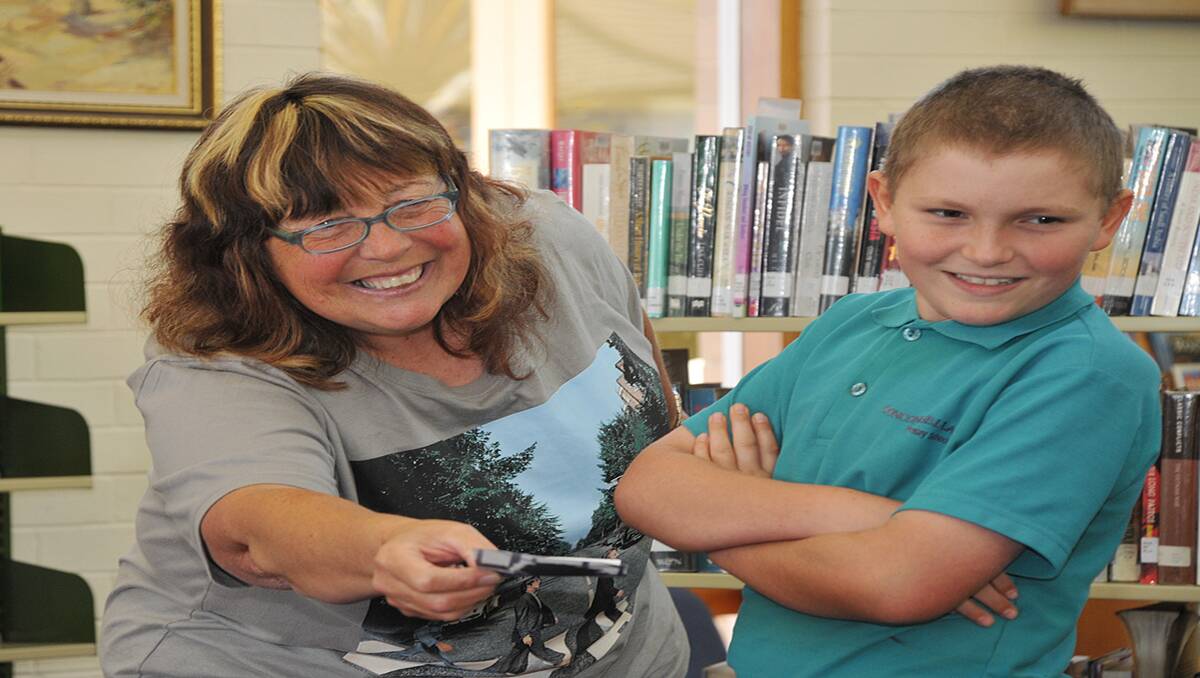 Children's author, Susie Sarah is pictured at the Stawell Library with Ryan, making up poems about children's pets. Picture: KERRI KINGSTON
