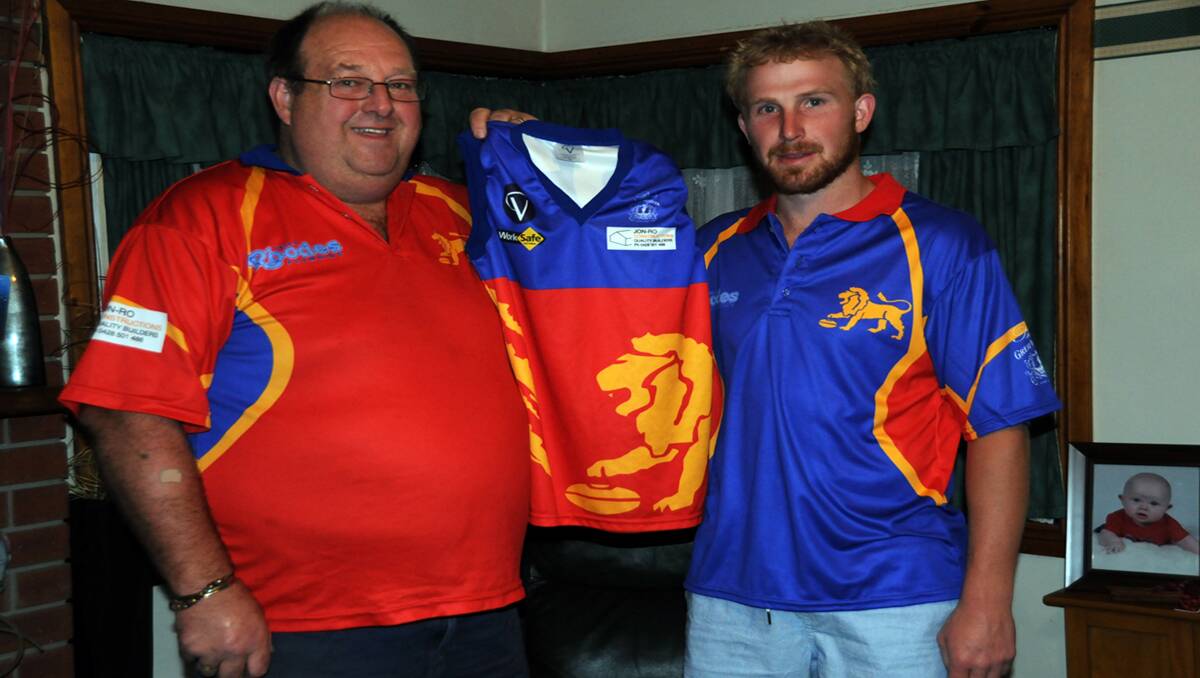 New Great Western Football Club senior coach, Nick Thomas (right) receives his new club uniform from Great Western Football Club president Rodney Matheson following his appointment last week. Thomas joins the Lions after a stint as assistant coach with the Stawell Football Club. Picture: CONTRIBUTED