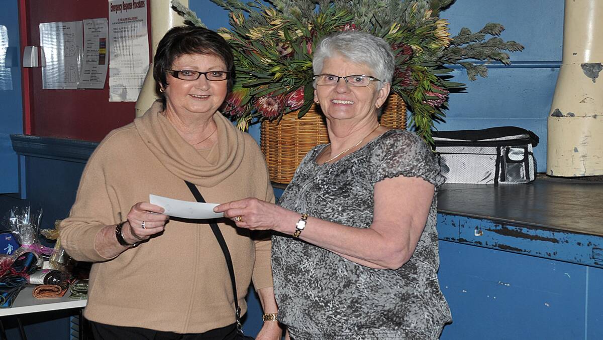 Stawell Senior Citizens committee member, Jeanette Ekman (right) hands over a cheque to Stawell Regional Health board chair, Joan Brilliant.