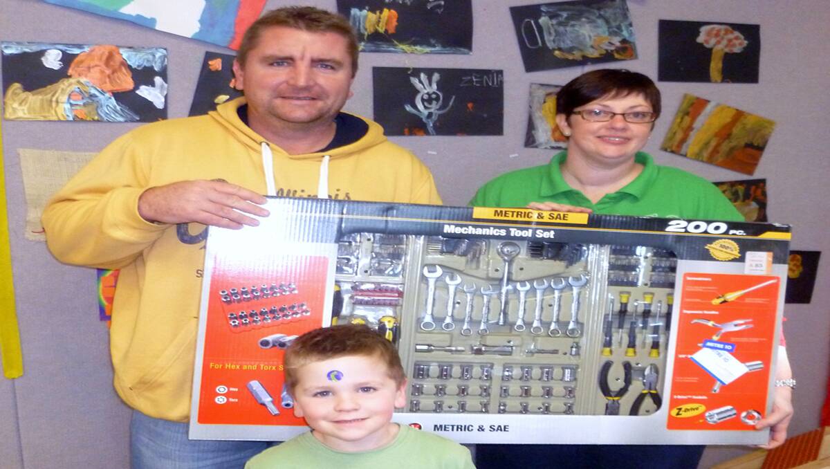 Rhett and Ashton Mellor are pictured accepting the major prize, a tool kit, from Michelle Warren.