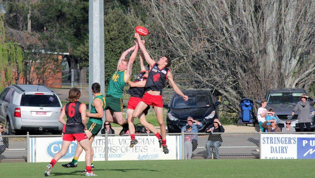 Navarre full-forward, Kris Brennan flies high in an attempt to mark the ball in Saturday's thrilling contest between the Grasshoppers and Carisbrook. Navarre has progressed through to the MCDFL grand final after defeating Carisbrook by four points at Princes Park, Maryborough. Picture: BARRY WISEMAN 