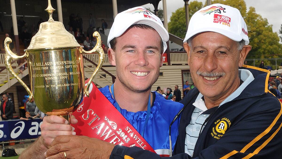 Andrew Robinson with his coach Ray Quarrell after his 2013 Stawell Gift victory.