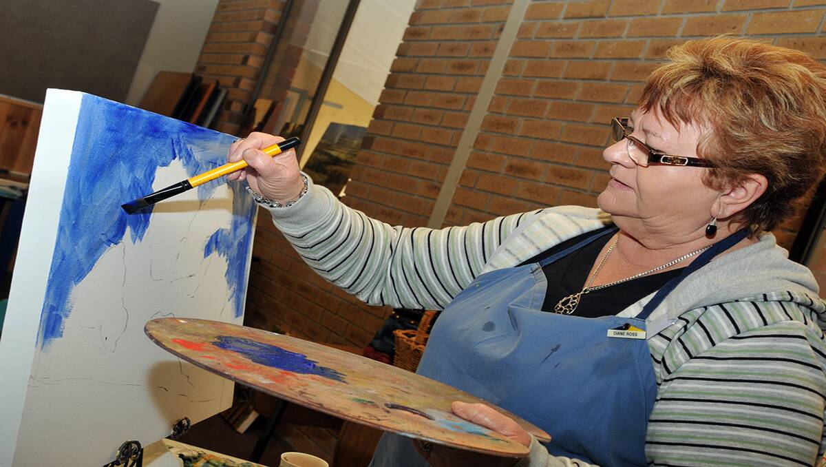 Dianne Ross of Stawell, works at blocking in an acrylic painting at a Grampians Brushes workshop. Picture: KERRI KINGSTON