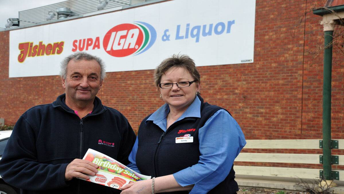 Chris Blake from the Grange Golf Club and Sandy Pyke from Fisher's IGA in Stawell sign off on Sunday's 27 hole ambrose competition at the Grange. Picture: MARCUS MARROW