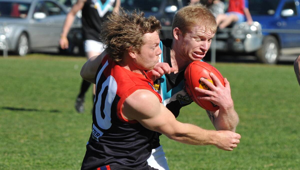 It's mine - Swifts defender Owen Phillips with the football, was determined to fend off his Laharum opponent during the HDFL semi final clash at Pimpinio on Sunday. Swifts advanced to the preliminary final with an upset 28-point win over Laharum. Picture: MARK McMILLAN