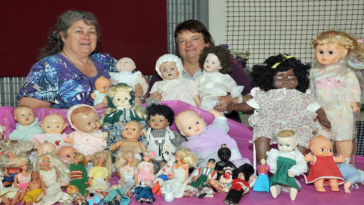 Pauline Holden and Lyn Keller with dolls that will be up for sale tomorrow at Laidlaw Park to raise money for breast cancer research.