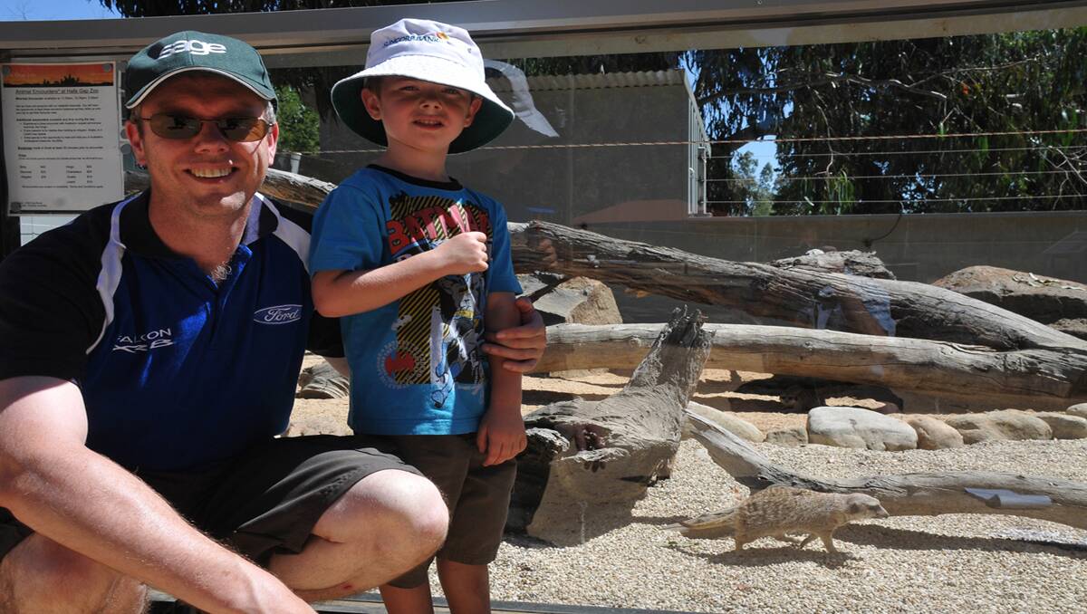 Halls Gap has been a popular destination for tourists not only from interstate, but throughout the world. One of the most popular attractions has been the Halls Gap Zoo, due to the constant improvements implemented by owners Greg and Yvonne Culell. Visitors such as Dale and Lachlan who are pictured in the Meercat enclosure, can’t wait to have a close up experience with the various animals at the Zoo. Picture: BEN KIMBER