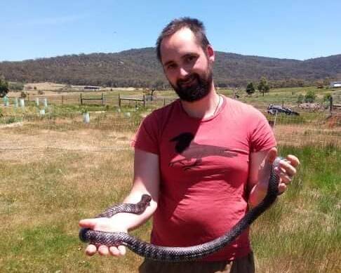 SNAKE CATCHER: Gianni Hodgson with one of his scaly friends. Picture: CONTRIBUTED 