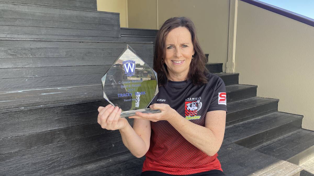 WINNER: Tracey Dark with the 2021 WFNL C Grade best and fairest trophy. Picture: TALLIS MILES