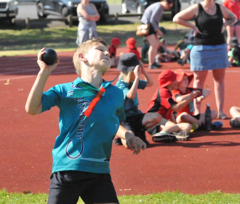 EFFORT: Concongella Primary school pupil Harry Gibson gives it his all in the 10 year-old boys shot put. Picture: TALLIS MILES