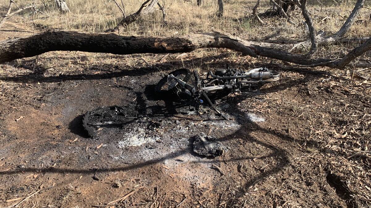 ASHES: The motorcycle involved in the tree fire has been burnt to ashes. Picture: TALLIS MILES