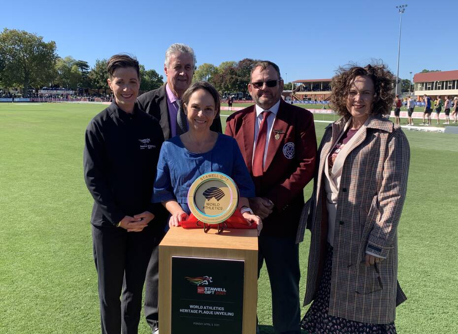 HIGH HONOUR: Stawell Gift Event Management Committee chair Stephanie Spence (left), Northern Grampians Shire Council Mayor Murray Emerson, Acting Minister for Tourism, Sport and Major Events Jaala Pulford, Stawell Athletic Club president Neil Blizzard and Power General Manager of Corporate Affairs Joanne Pafumi with the IAAF World Athletics Heritage plaque. Picture: TALLIS MILES