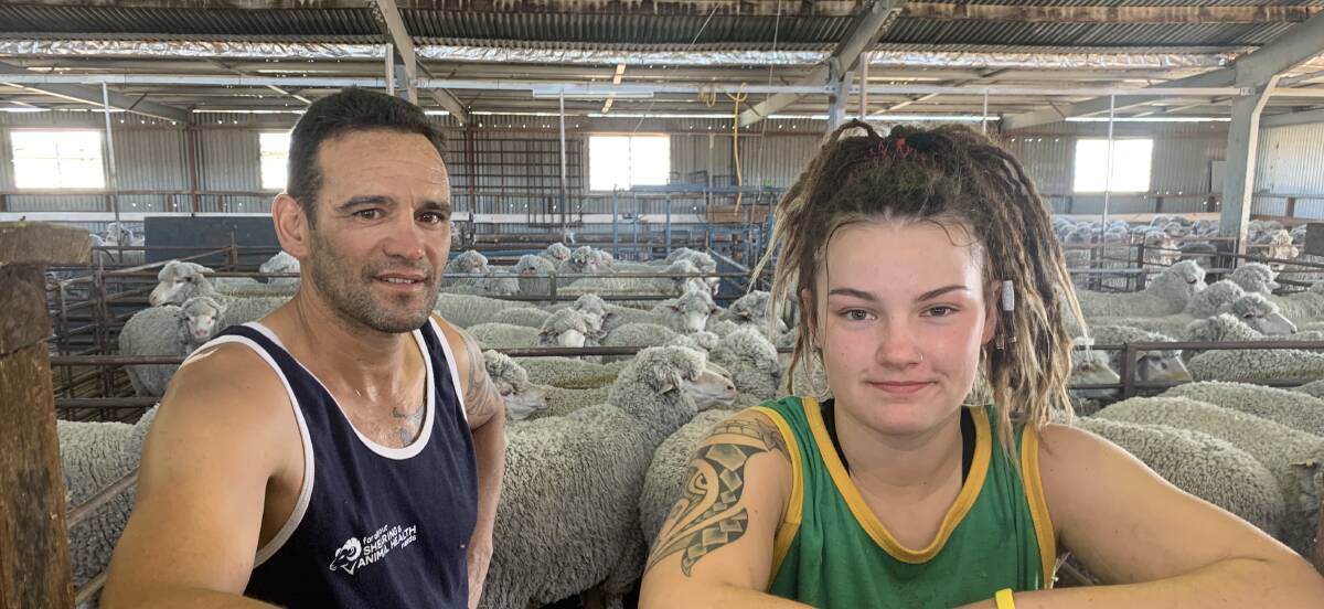 HARD WORK: Roger Pearse (left) and Elysia Musgrove (right) have been working as hard as possible to help overcome the shearer shortage in the region. Picture: TALLIS MILES