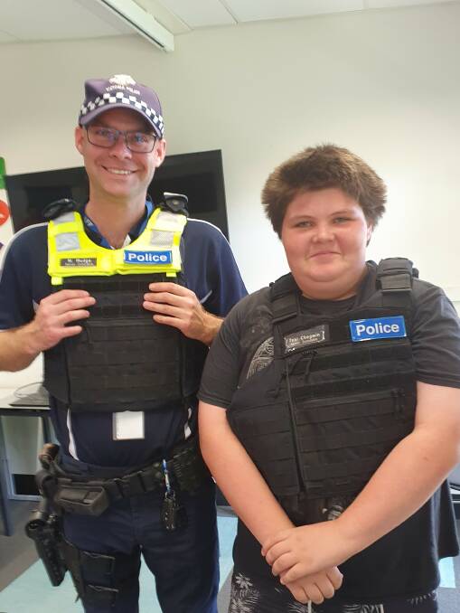 SMILES: VicPol Constable Max Mudge speaks to Skene Street student Alex about a career in the police force. Picture: CONTRIBUTED
