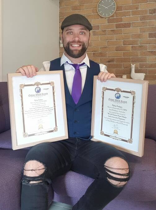 WORLD FIRST: Phil Hedges with his two world records. Picture: CONTRIBUTED