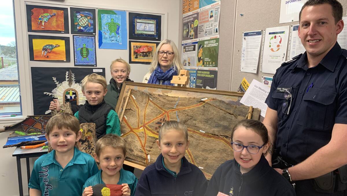 LEARNING: Concongella Primary School students Ted, Angus, Bellamy, William, Millie and Mina with their Art teacher Lynette Cox Hayward and Stawell Police sergeant Eddie Malpas. Picture: TALLIS MILES