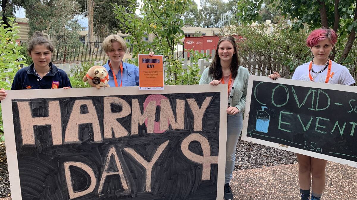 Grampians Youth Events FreeZa group members Annie Smedhurst, Charlie Wilson, Taia Hayter and Pixie Cunningham with their signs for Harmony Day. Picture: TALLIS MILES
