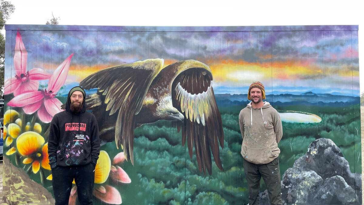 ARTISTS: Conrad Bizjak and Mike Maka in front of the mural at WAMA. Picture: CONTRIBUTED