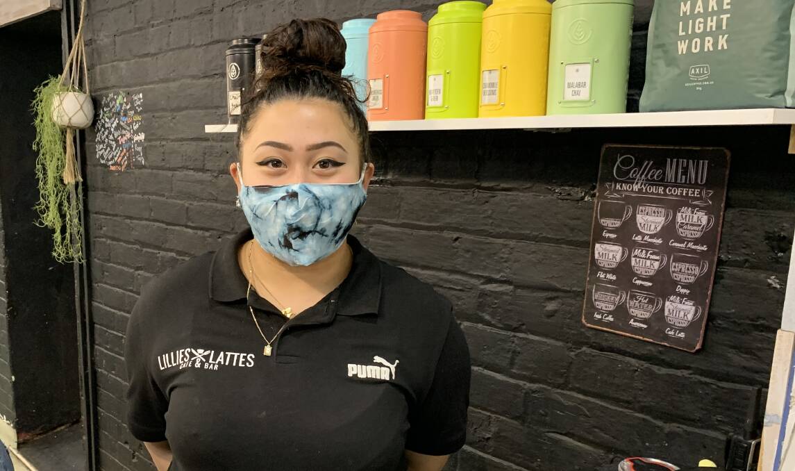 MASK-UP: Lillies and Lattes Cafe and Bar barista Andrea Clark is back to wearing her mask behind the coffee machine. Picture: TALLIS MILES