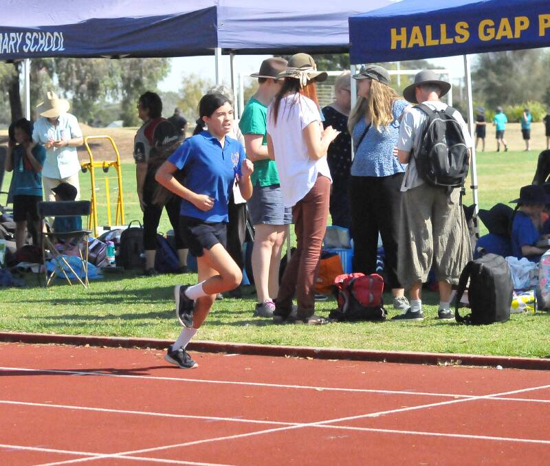BLUE RIBBON: Halls Gap pupil Sophie Mudford chases the win in the 12 year-old girls distance running. Picture: TALLIS MILES