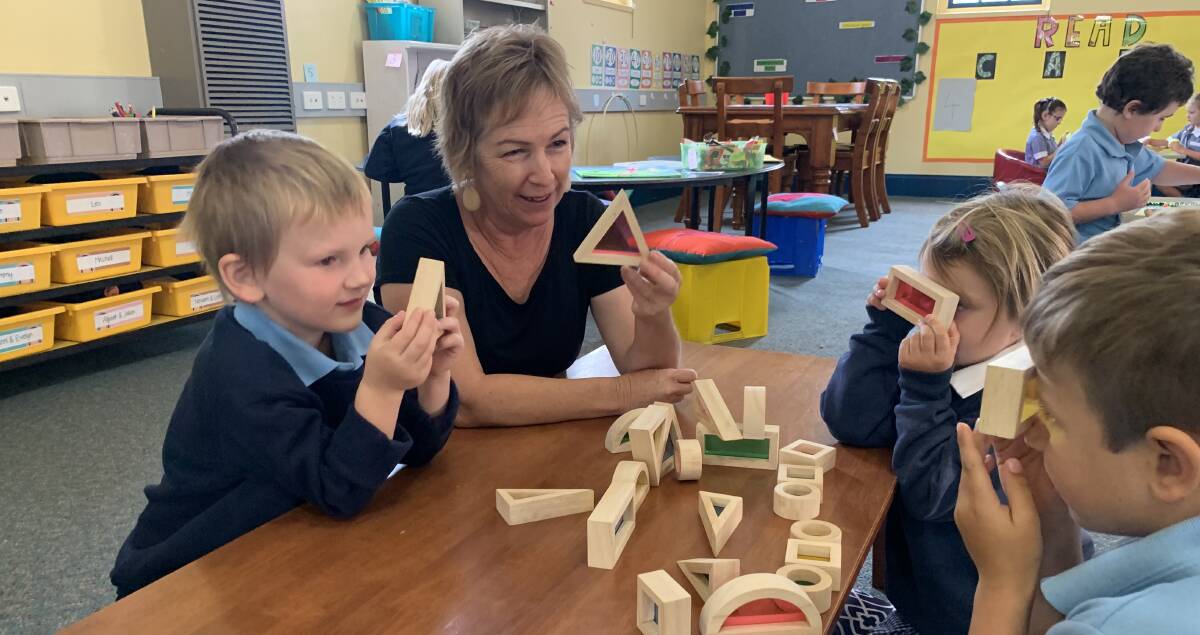 PLAY TIME: Stawell Primary School Foundations teacher Treen Sloarch with William, 5 (left), Amber, 5, and Oscar 5. Picture: TALLIS MILES