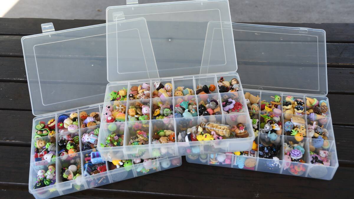 BOXES: It takes Rachel about over a year to fill one of her containers full of charms. 