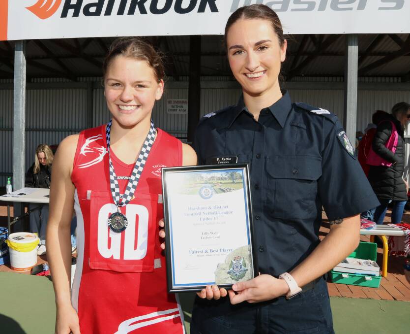 Taylors Lake's Lilly Weir receives her Blue Ribbon Foundation Spirit of Netball award from Horsham police officer Bianca Kettle. Picture supplied