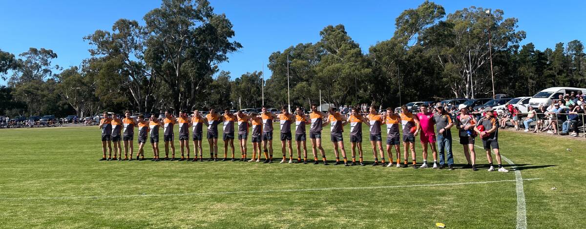 The Southern Mallee Giants line-up for the national anthem before the 2023 WFNL seniors grand final at Dimboola Recreation Reserve. Picture by Lucas Holmes