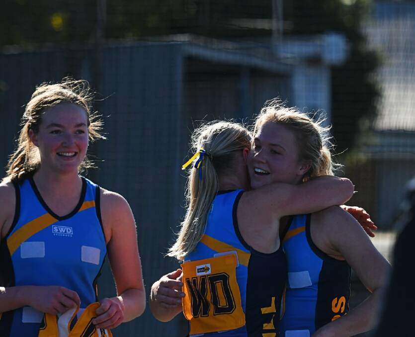 Jasmine Talbot and Jenna Schneider embrace following Nhill's victory in the round 10 WFNL match at Davis Park. Picture by Lucas Holmes
