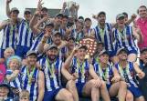 The Harrow Balmoral Southern Roos celebrate winning the 2023 HDFNL premiership with the league shield and trophy. Picture by John Hall