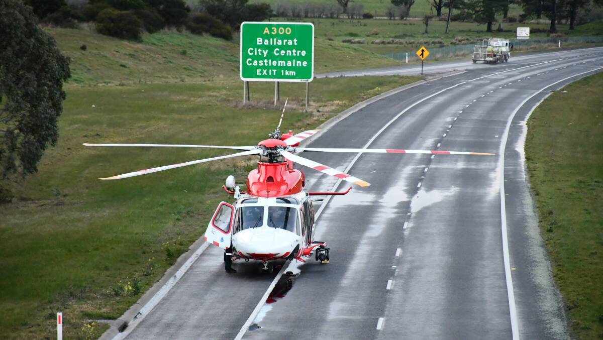 The air ambulance lands on the Western Freeway. Photo: Alex Ford.