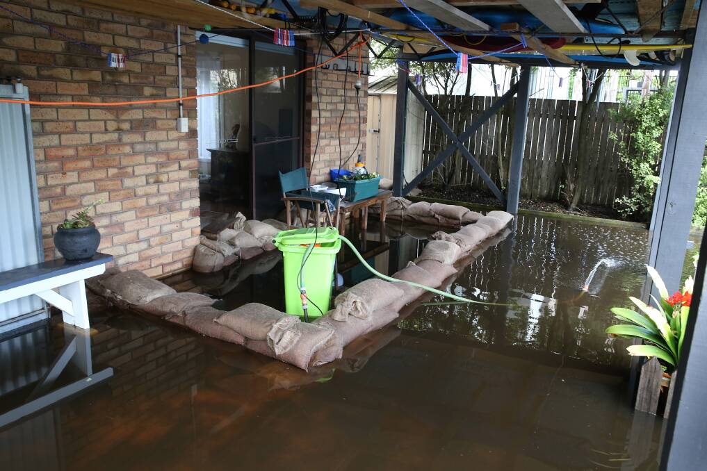 Floodwaters broke through sandbagging around Pam and Trevor Hockley's backdoor on Saturday morning. Picture: Mark Witte