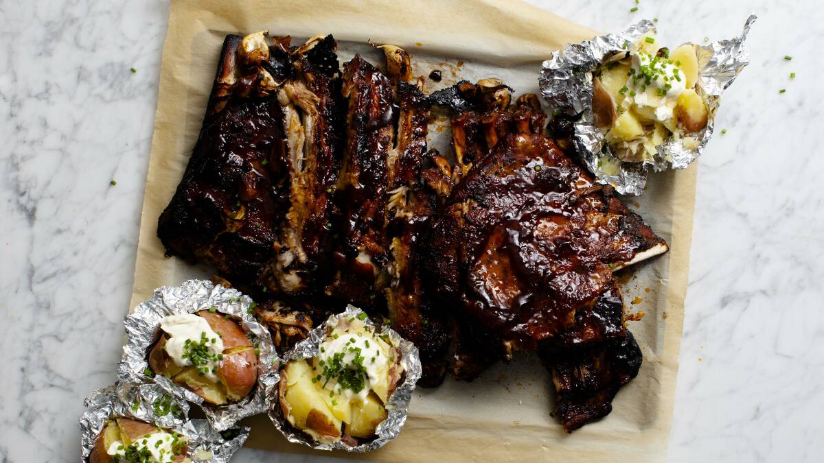 Sticky ribs and foil spuds. Picture: Lucy Tweed