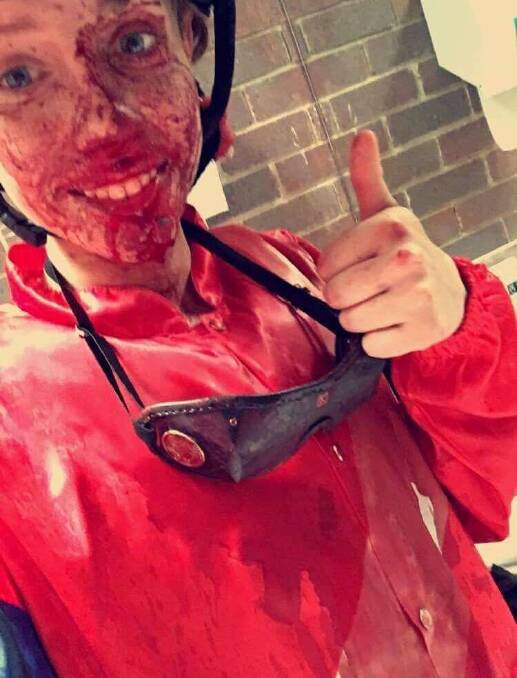 Bloody mess: Jess Eaton gives the thumbs up despite having her face and silks covered in blood following her broken nose.