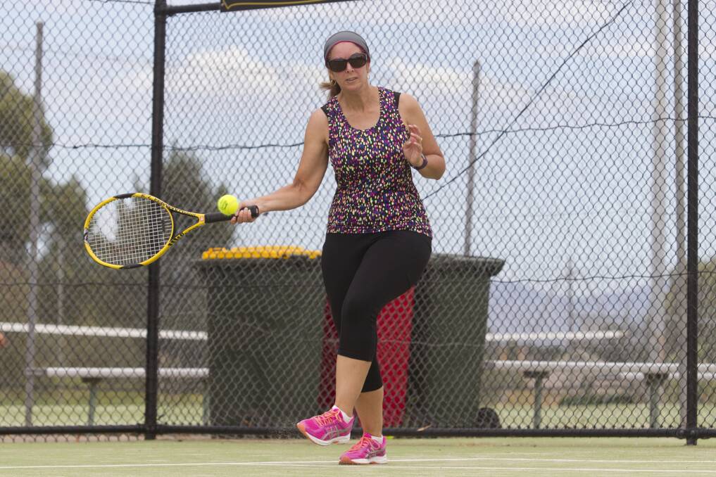 Eyes on the ball: Kim Hutton uses her feet to get into position to make a forehand return during Stawell Tennis action last week. Picture: Peter Pickering