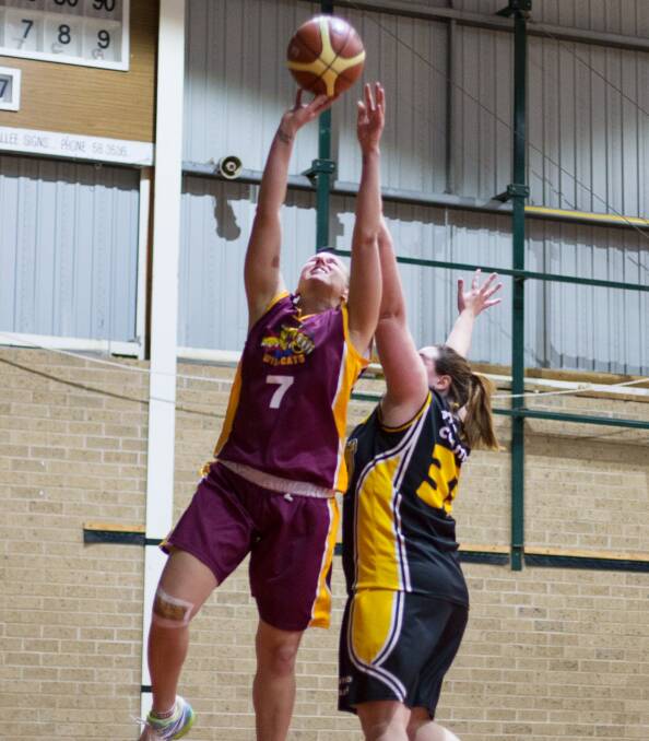 Contested rebound: Roxane Moos was at full stretch when she pulled in this offensive rebound earlier this season. Picture: Peter Pickering