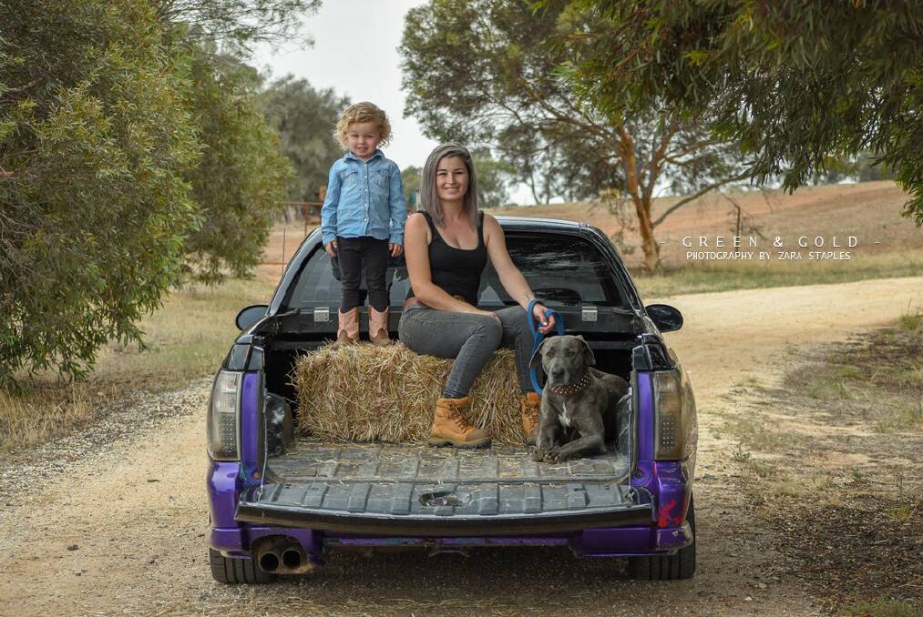 KEEPING BUSY: Tayla Wyllie with her daughter Kallani and dog Willow. Picture: ZARA STAPLES