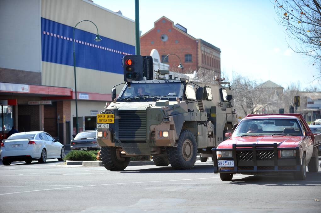 A Bushmaster's handling is tested in the middle of Bendigo in 2012. Picture: BILL CONROY