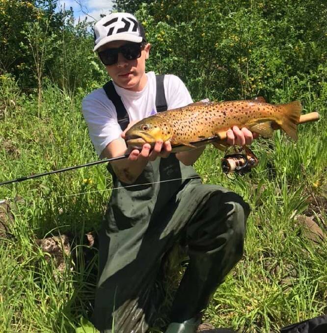 NICE CATCH: Xavier Ellul with his late season trout, a PB he caught in the Merri River.
