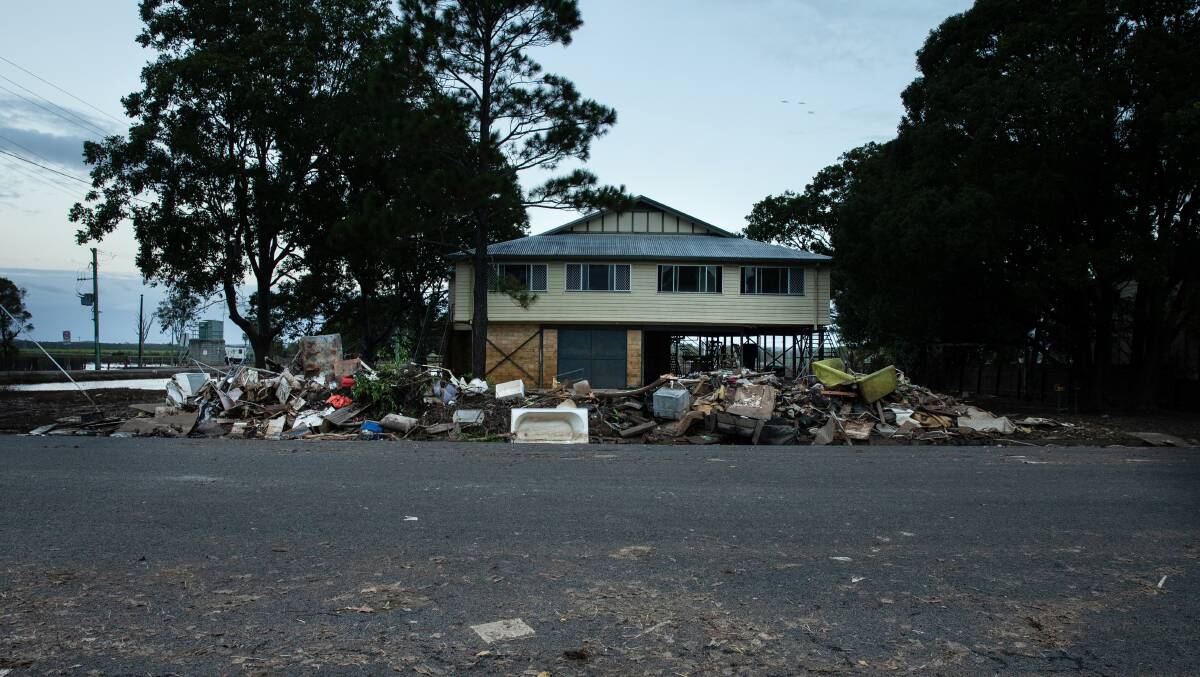 A home on Richmond Street, Woodburn. The flood damaged contents piled up on the nature strip. Thursday 7th April 2022 // PHOTO BY MARINA NEIL // NEWCASTLE HERALD // NRFLOODS22