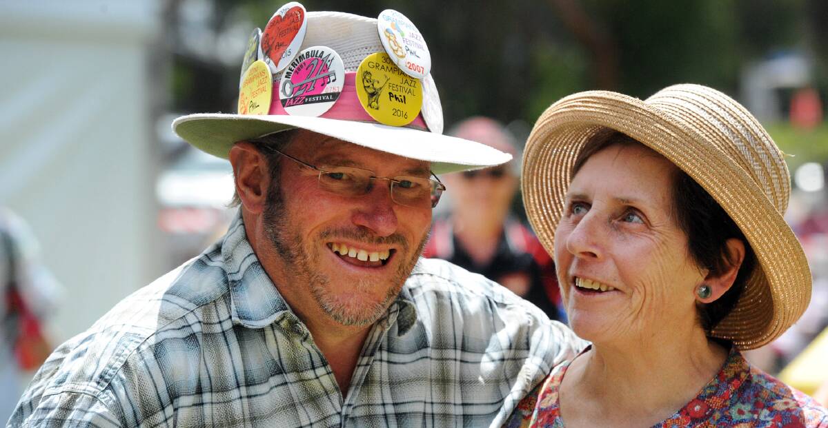 Hats off: Phil Procter shows off his jazzy hat to Alison Irvine at the Grampians Jazz Festival in Halls Gap on Sunday. Pictures: PAUL CARRACHER.