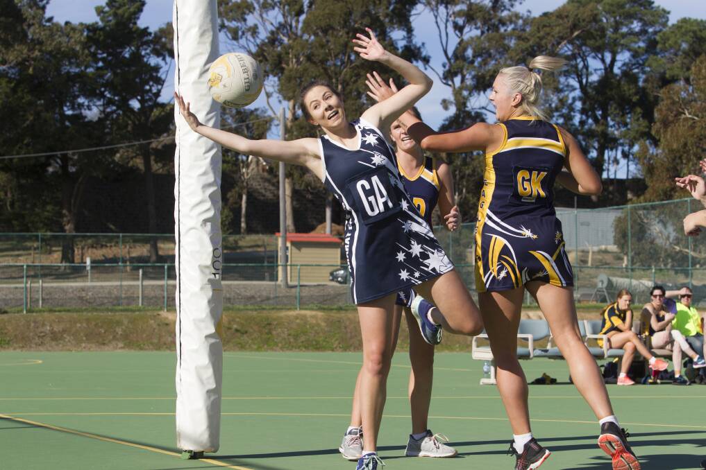 STRETCH: Ararat Eagles netballer Caroline Matthews tries to keep the the ball in play during the A Grade clash against Hawkesdale-Macarthur. PICTURE: Peter Pickering